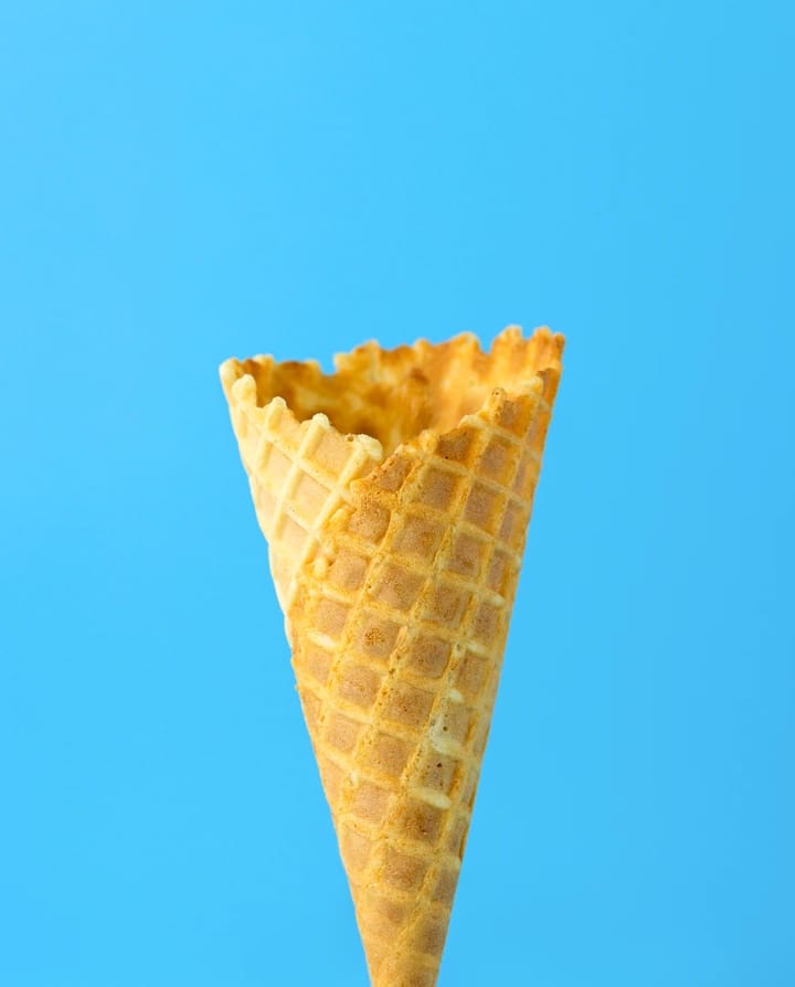 empty ice-cream cone against blue background