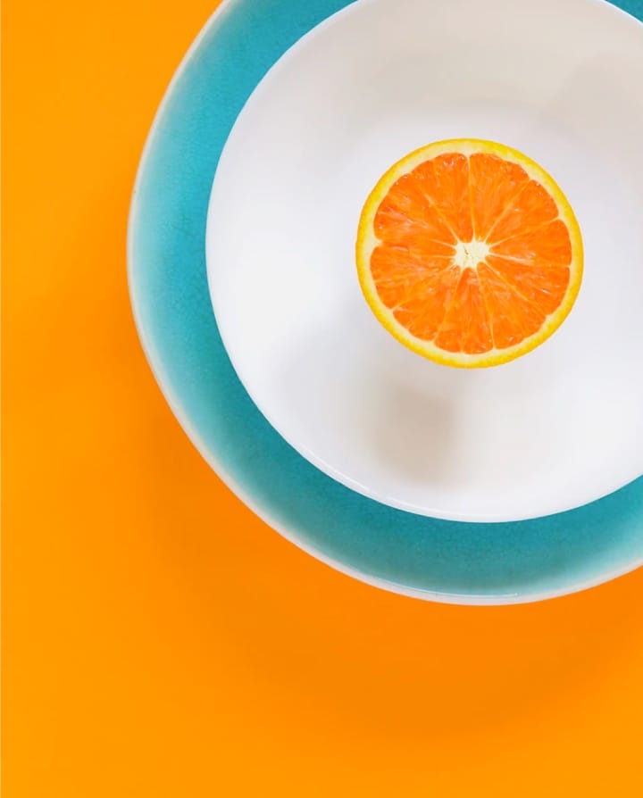 sliced oranges sitting on a plate